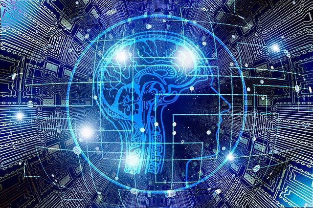 脳と電子回路が同期するイメージの青いデジタルイラスト。